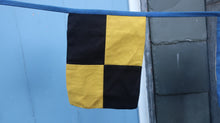 Load image into Gallery viewer, View of an individual signal flag in yellow and black squares
