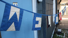 Load image into Gallery viewer, Nautical style bunting spelling out the word Welcome.
