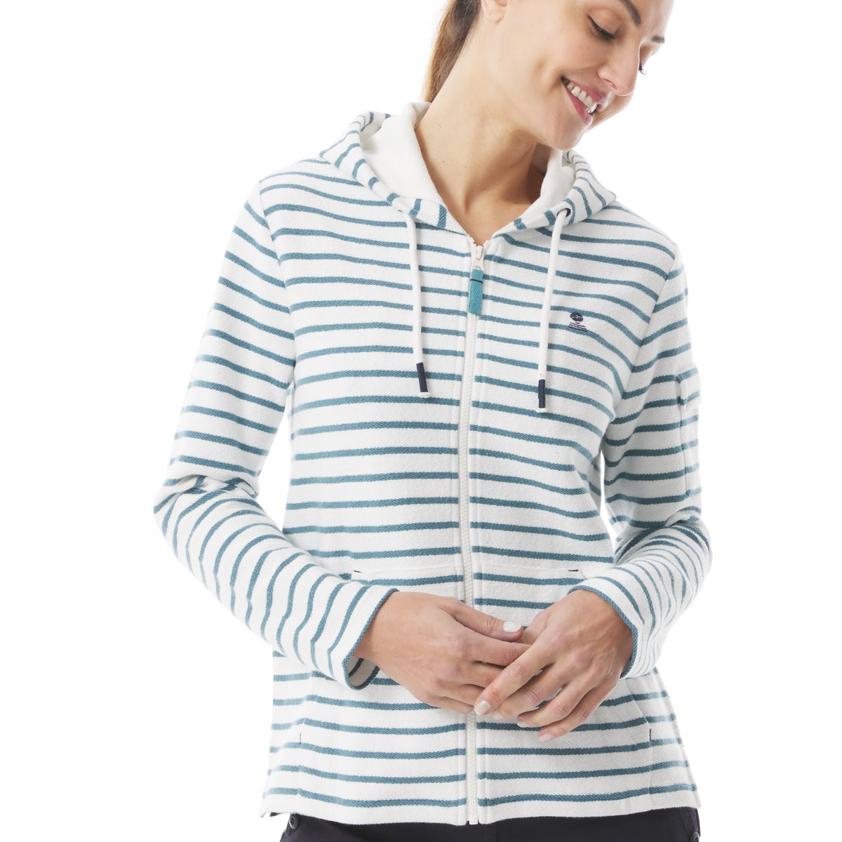 Woman wearing a zip up hoodie in cream and provencal blue stripes. Made from organic cotton soft fabric with a textured terry side. Garment features front kangaroo style pockets.