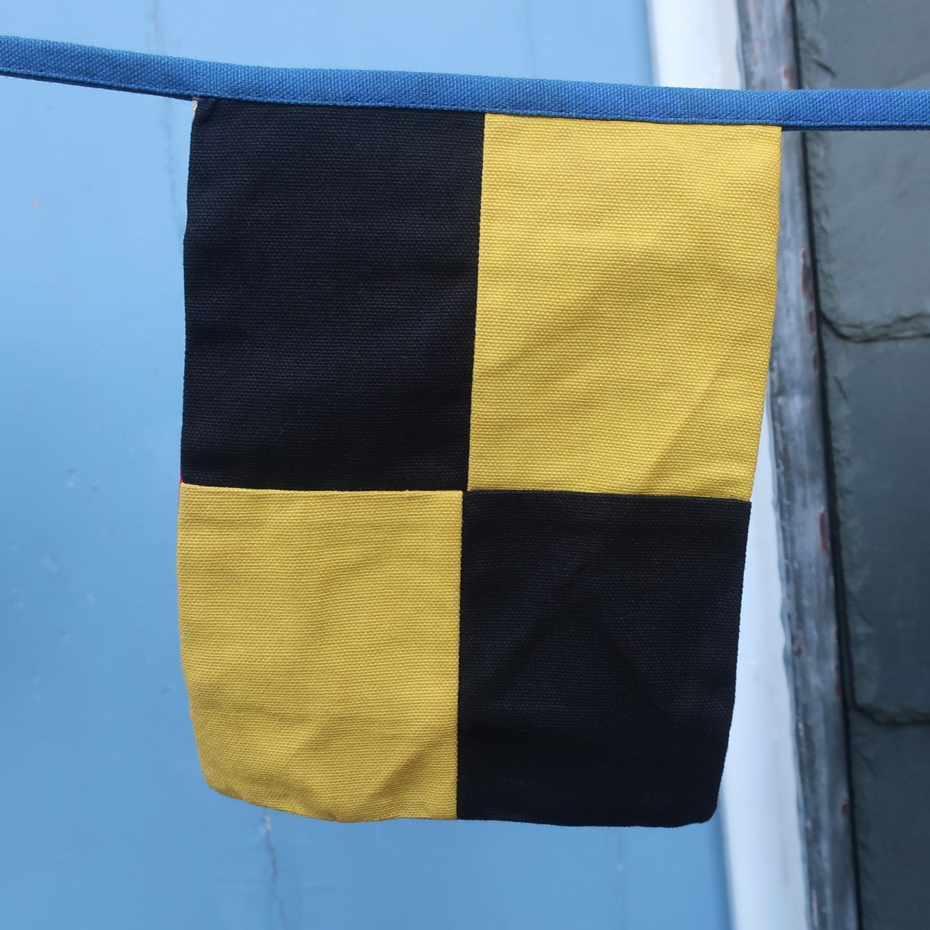 View of an individual signal flag in yellow and black squares