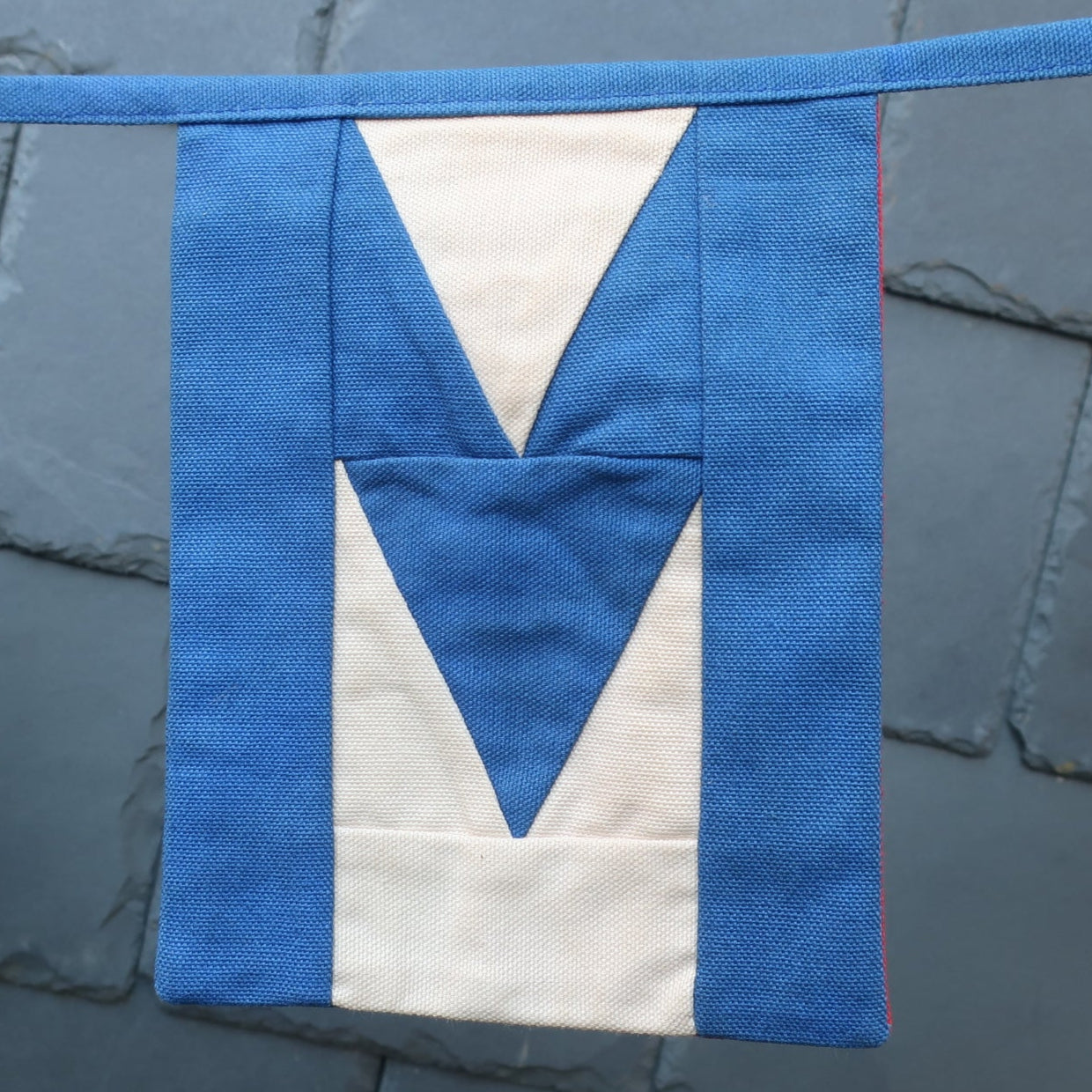 Flag showing the letter M from the Welcome bunting.