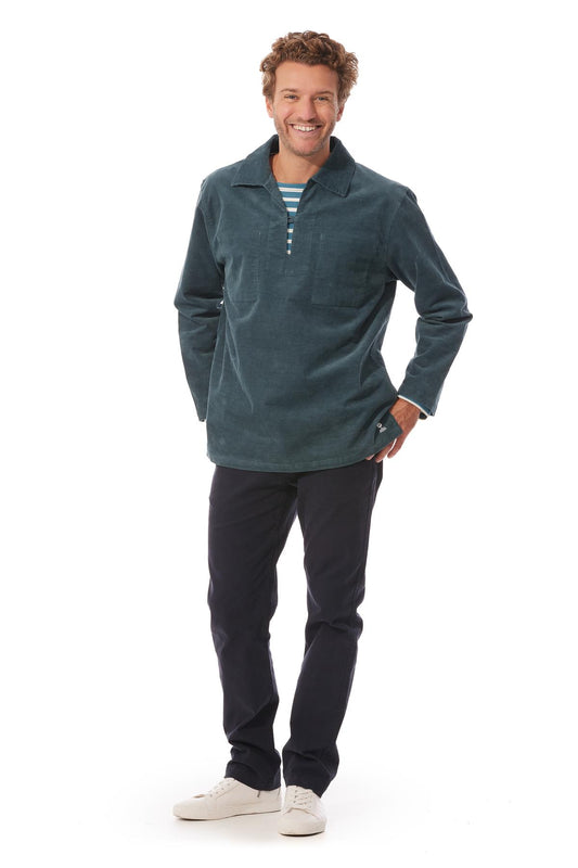 The Cachouroy is a fine corduroy version of the  traditional Breton Fisherman's smock. Shown here in a petrol blue colour. The top has a v neck and collar with a single fastening and two inside breast pockets.