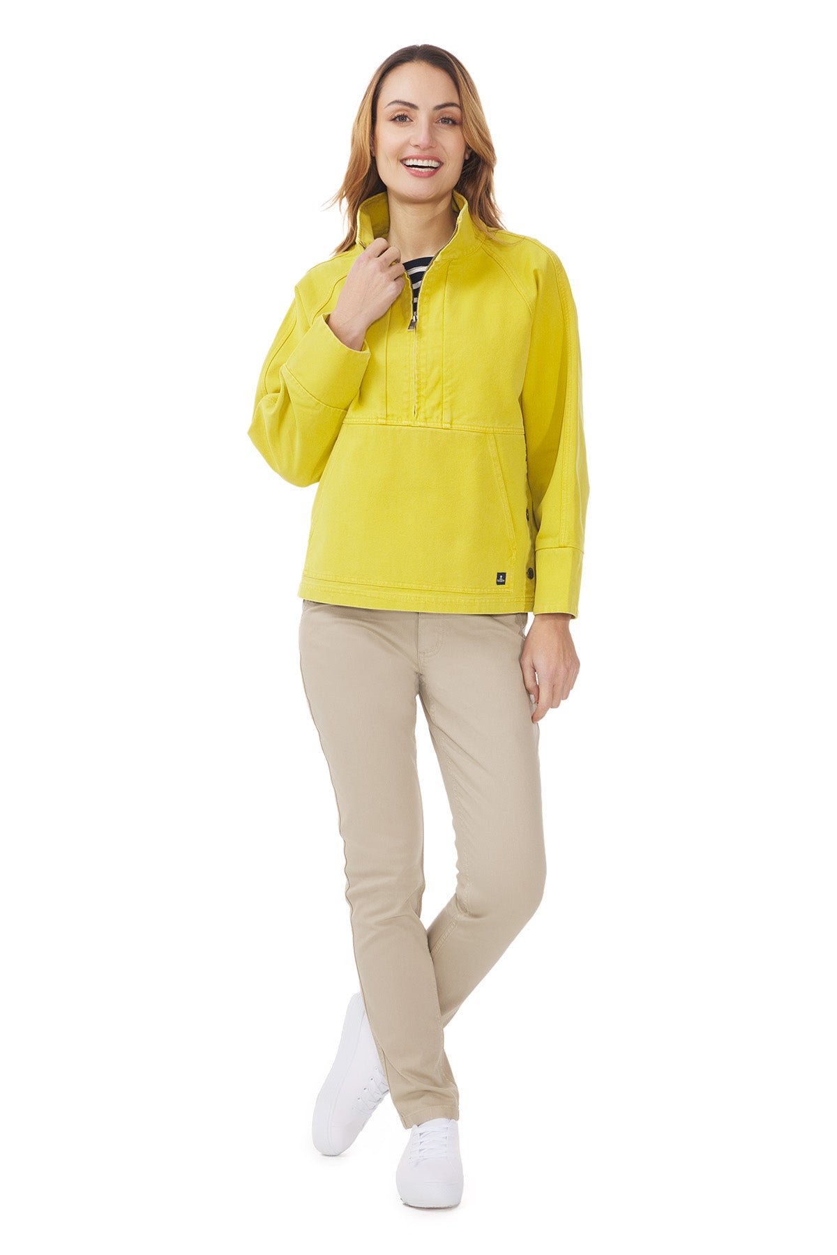 Image of a woman wearing the Mousqueton Yelli smock style top in yellow canvas.