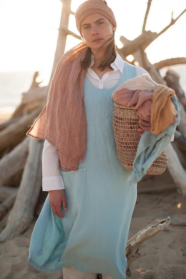 Picture of a hemp scarf worn in Rose Sable which is a soft pink terracotta colour.