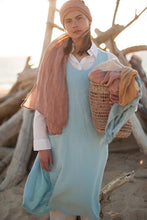 Load image into Gallery viewer, Picture of a hemp scarf worn in Rose Sable which is a soft pink terracotta colour.
